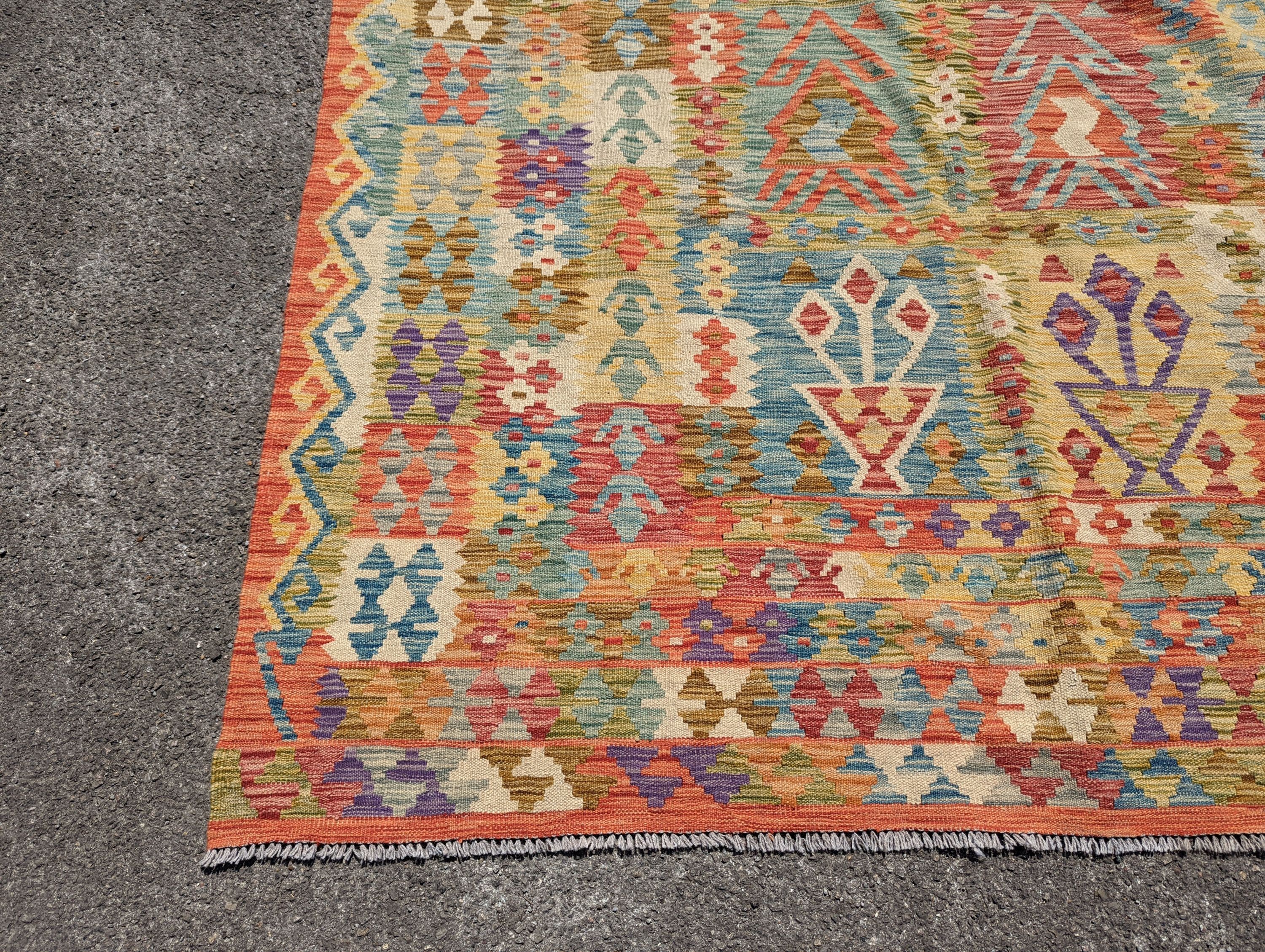 An Anatolian polychrome geometric flatweave Kilim carpet, 290 x 210cm